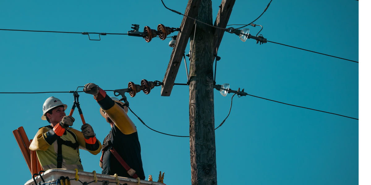 lineman using pliers while working