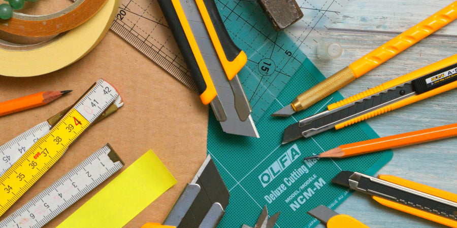 cutting tools and tape measures on work surface